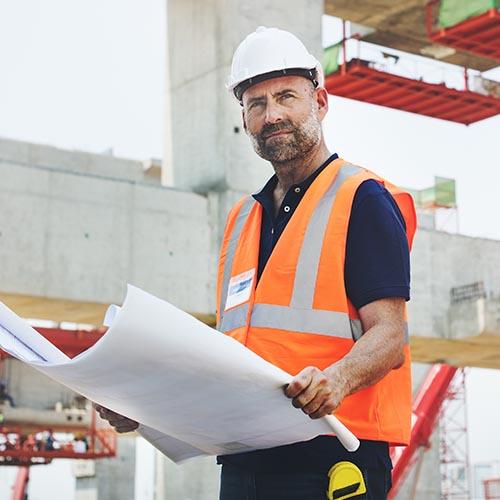 Builder on site looking pensive