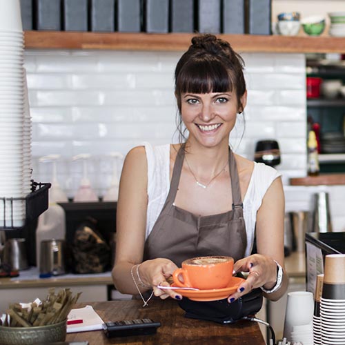 Barista serving a coffee