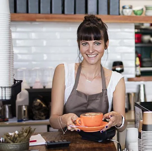 Barista serving a coffee